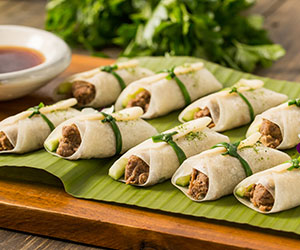 Peking duck wrap with spring onion and cucumber thumbnail
